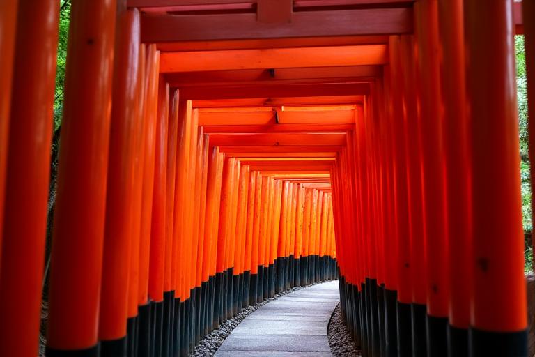 The iconic Fushimi Inari Shrine in Kyoto, Japan with its red torii gates.